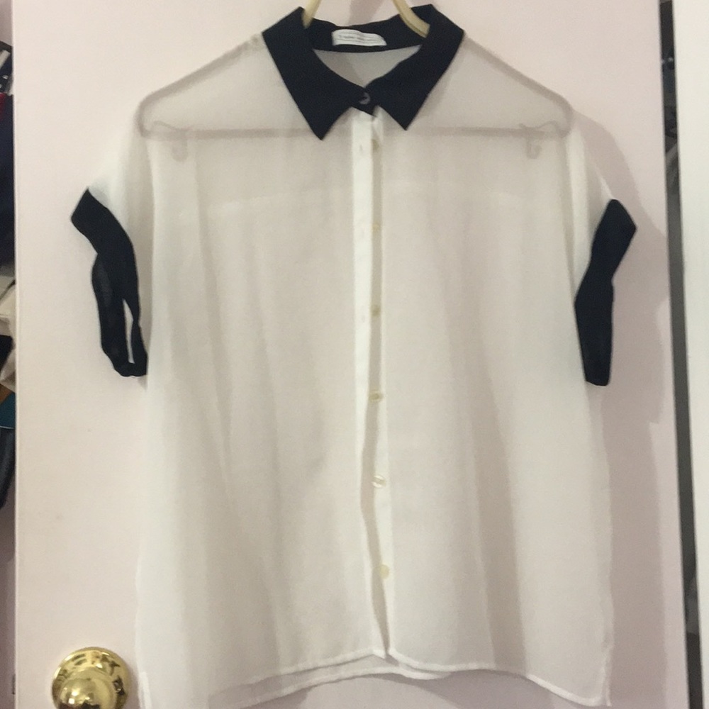 White button down shirt with black accents